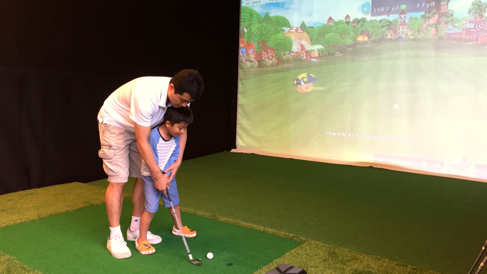 Indoor golf simulator room in a residential clubhouse